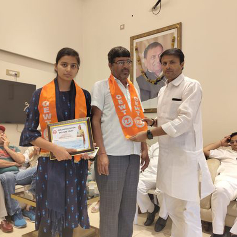 Portrait of an African Woman dressed in traditional costume, wearing decorative jewelry.